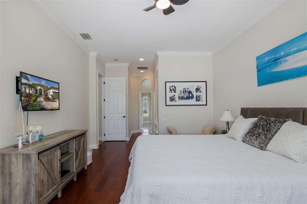 1429 El Pardo Drive Trinity, FL 34655 - Photo 29 of 100 a bedroom with a bed and a flat screen tv