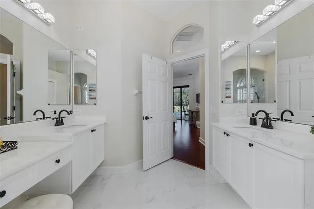 a swimming pool with outdoor seating