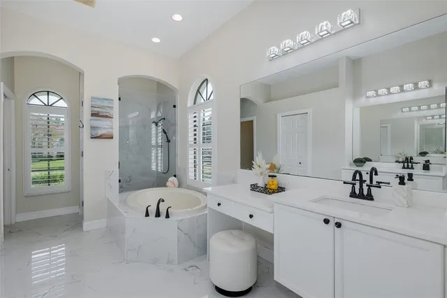 a view of a patio with table and chairs under an umbrella