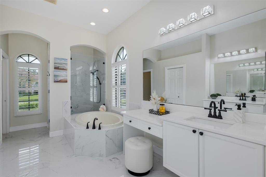 1429 El Pardo Drive Trinity, FL 34655 - Photo 33 of 100 a bathroom with a tub sink and mirror