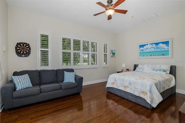an aerial view of residential houses with outdoor space and swimming pool