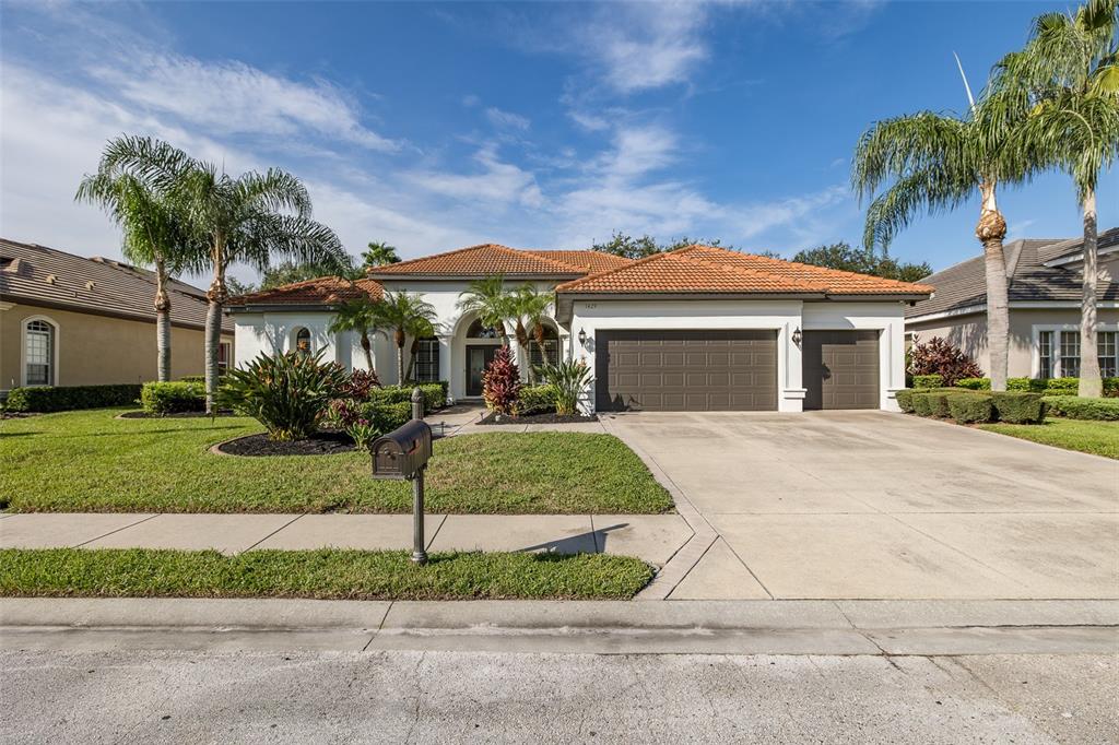 1429 El Pardo Drive Trinity, FL 34655 - Photo 70 of 100 a front view of a house with a garden