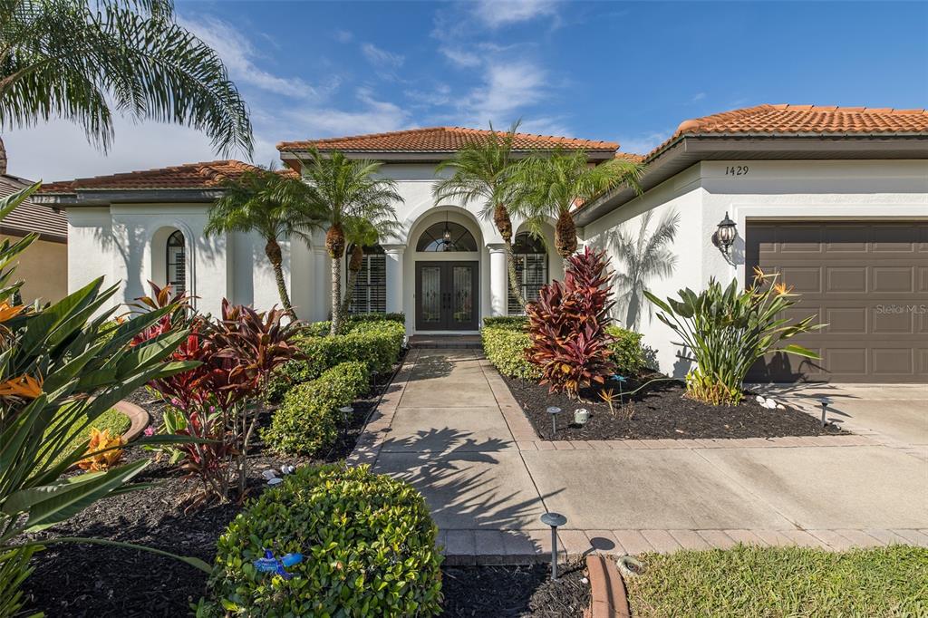 1429 El Pardo Drive Trinity, FL 34655 - Photo 73 of 100 a front view of a house with a garden