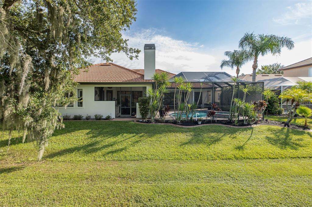 1429 El Pardo Drive Trinity, FL 34655 - Photo 82 of 100 a front view of a house with swimming pool having outdoor seating
