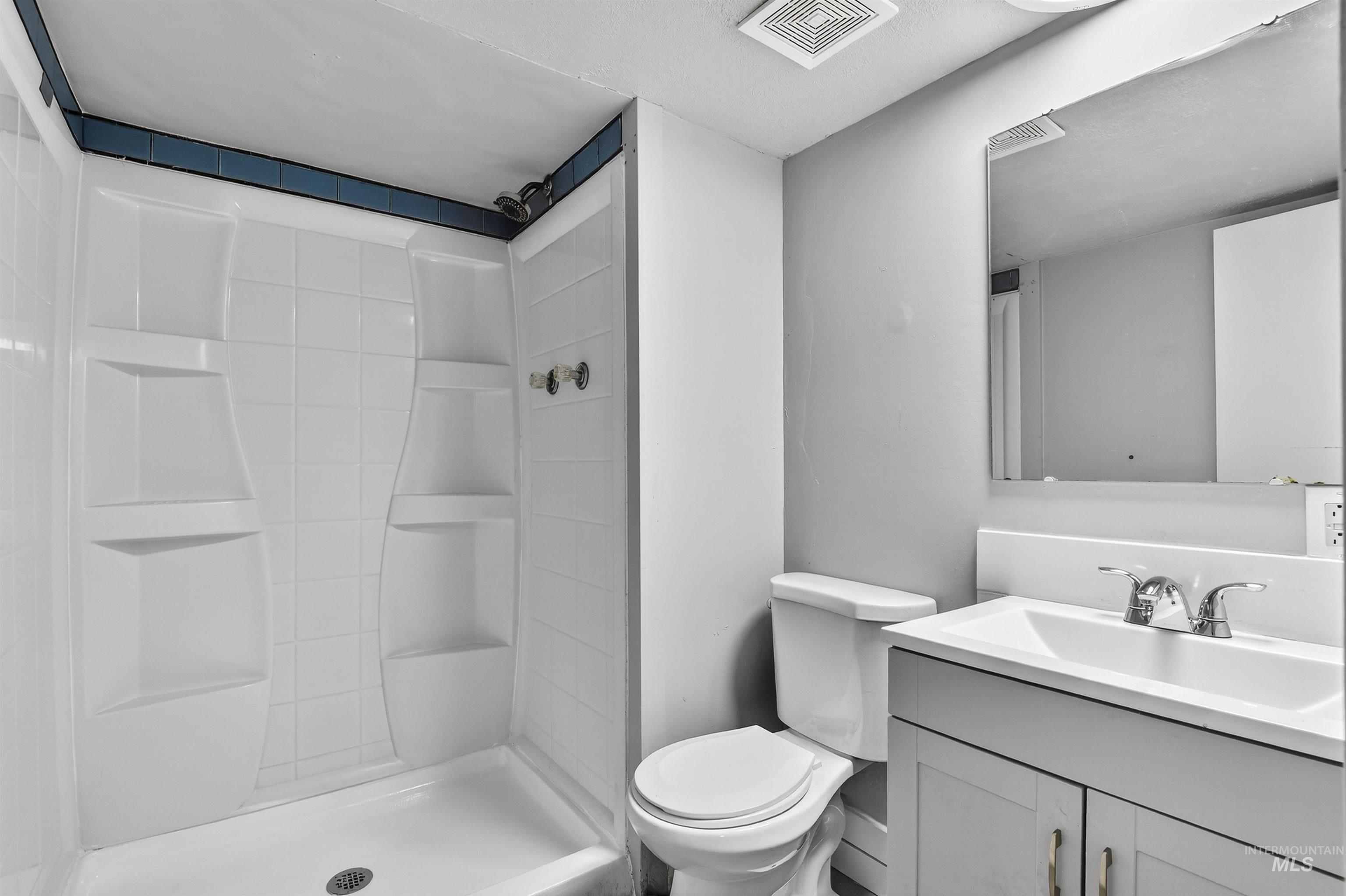 2118 West Targee Street Boise, ID 83705 - Photo 16 of 25 Bathroom with vanity and a shower stall
