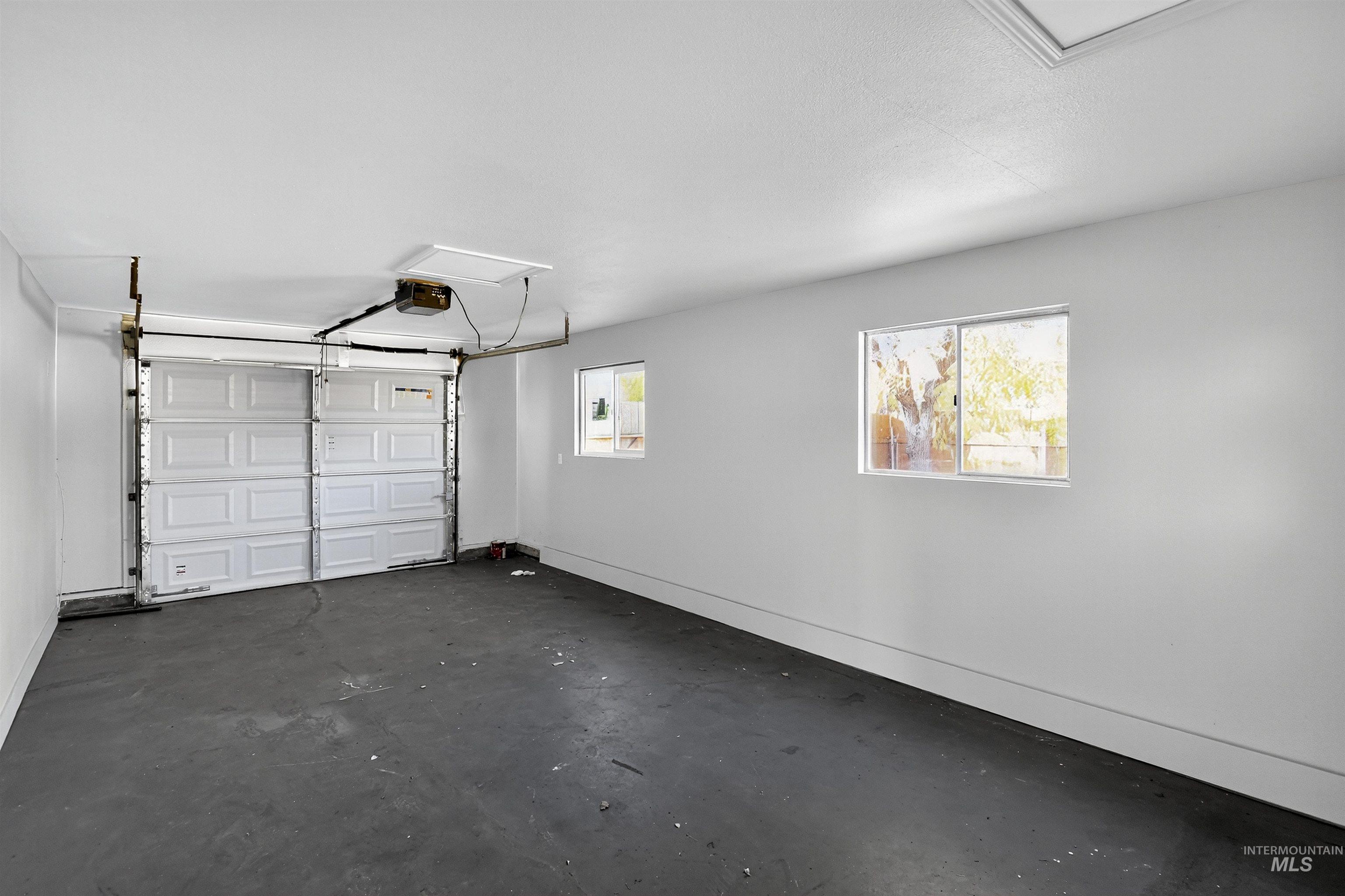 2118 West Targee Street Boise, ID 83705 - Photo 18 of 25 Garage with baseboards and a garage door opener