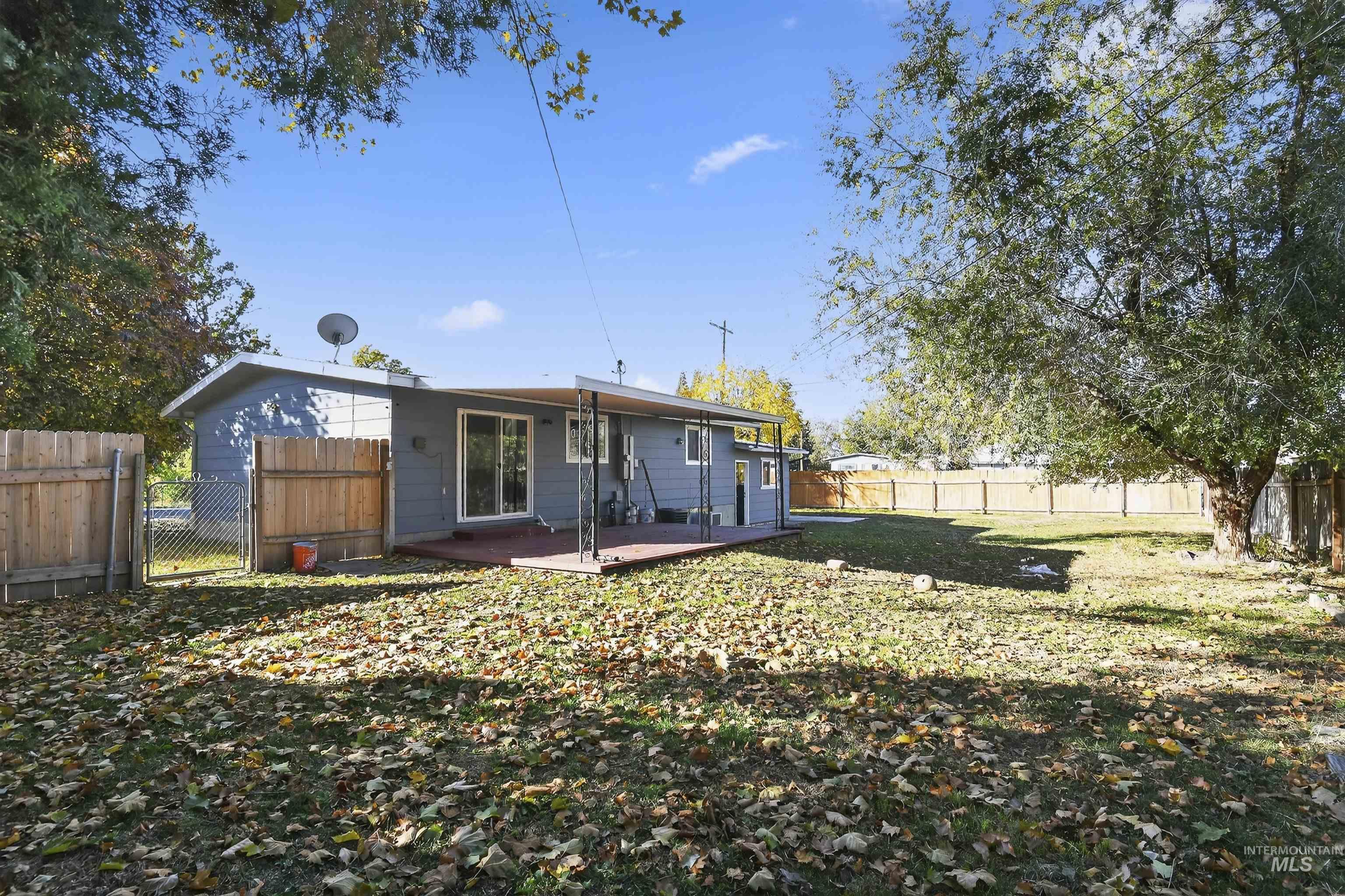 2118 West Targee Street Boise, ID 83705 - Photo 21 of 25 Rear view of property with a fenced backyard and a patio area