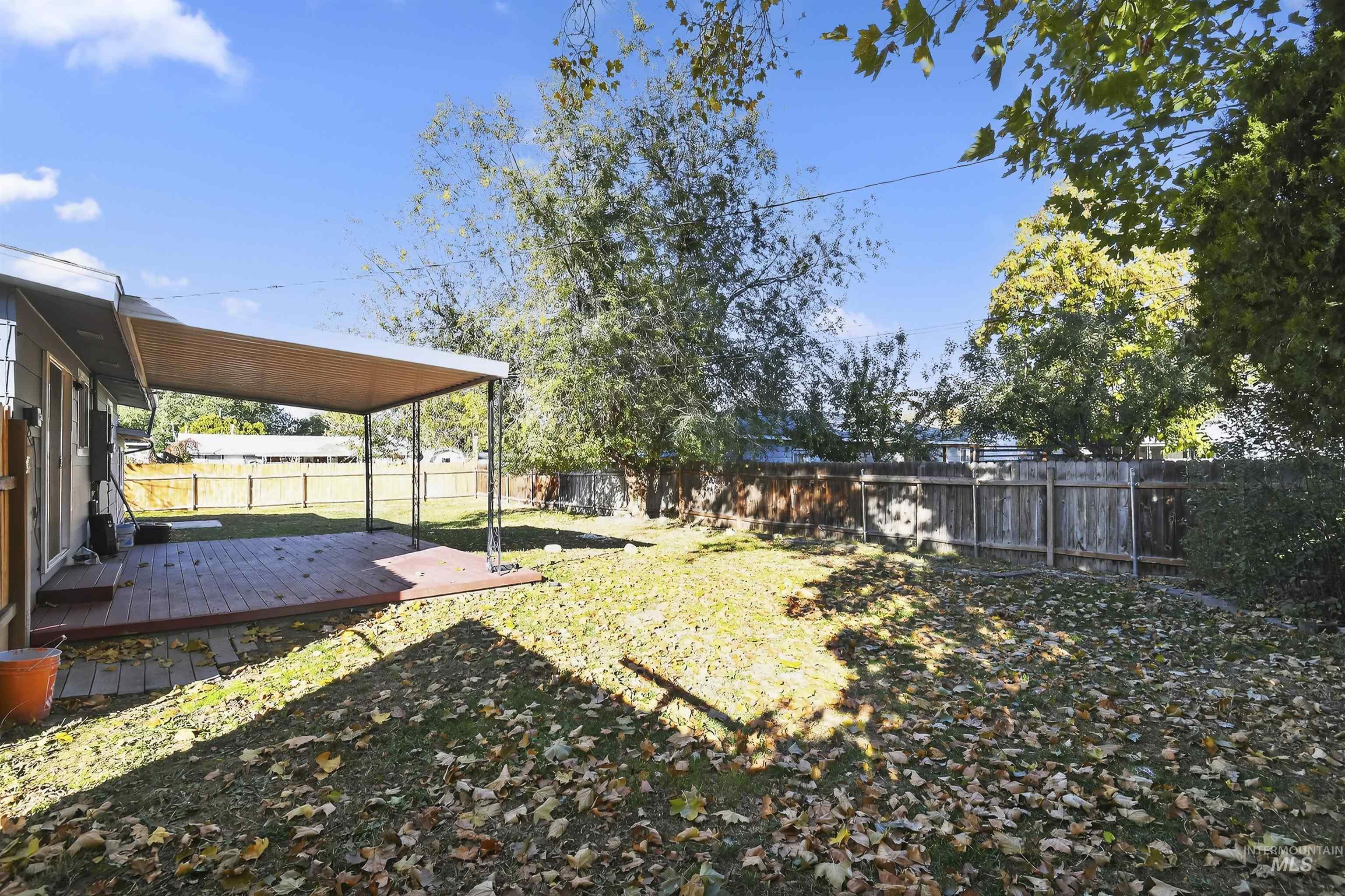 2118 West Targee Street Boise, ID 83705 - Photo 22 of 25 Fenced backyard featuring a wooden deck
