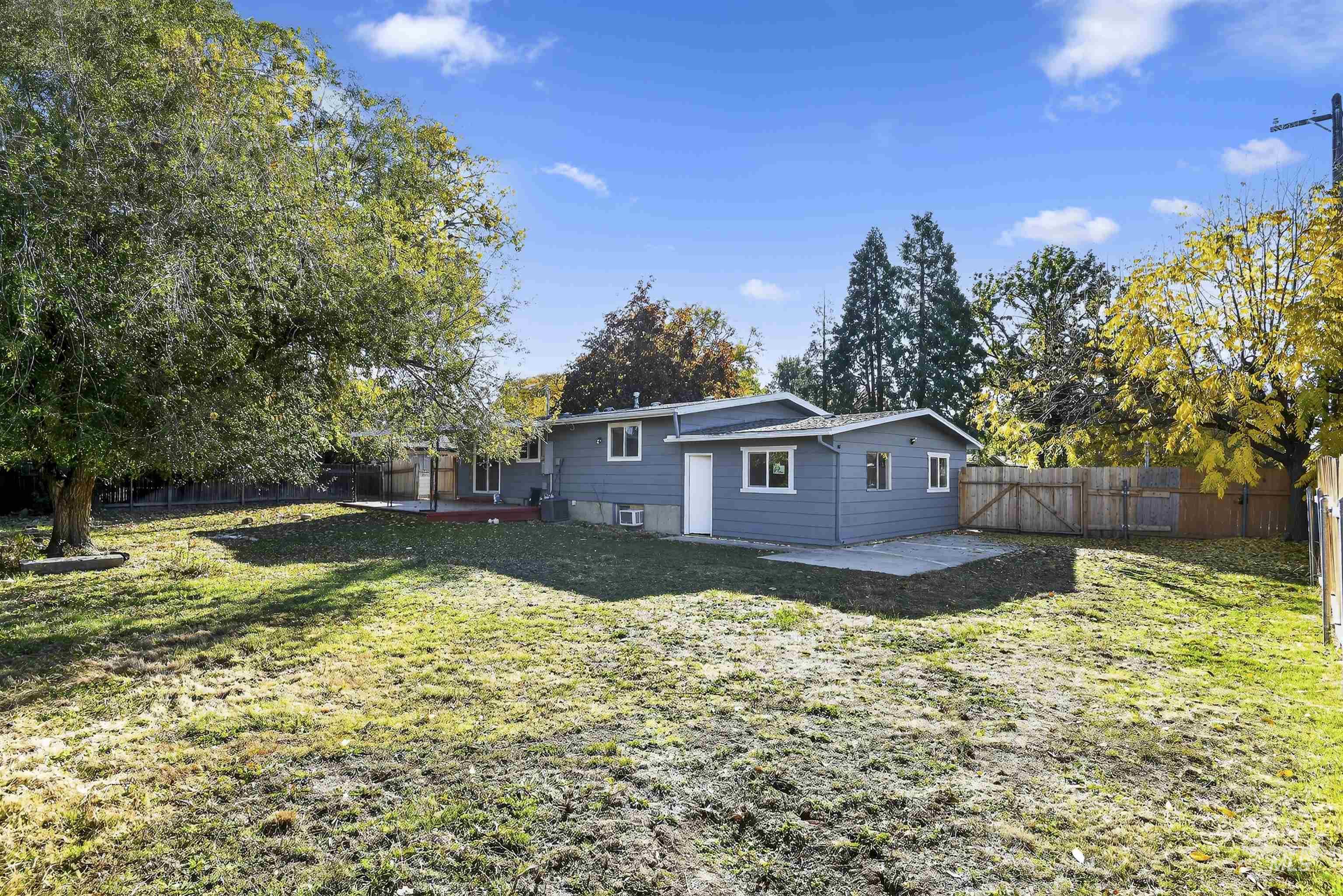 2118 West Targee Street Boise, ID 83705 - Photo 23 of 25 Back of house featuring a patio and a fenced backyard