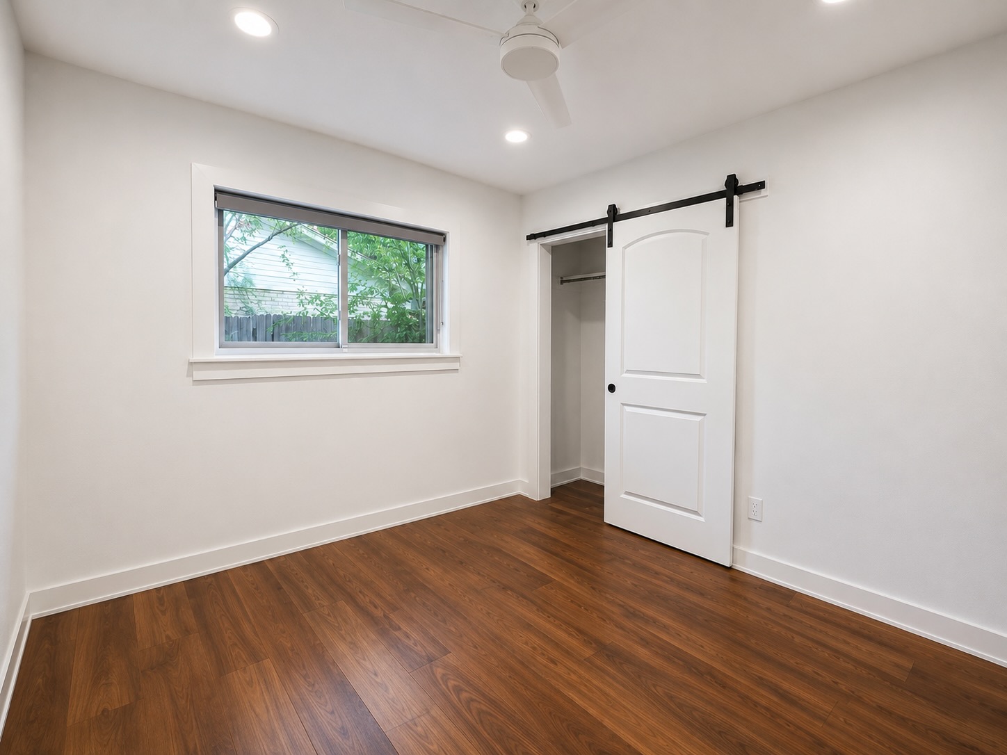2303 Remuda Trail Austin, TX 78745 - Photo 27 of 27 middle bedroom with space saving barn door closet