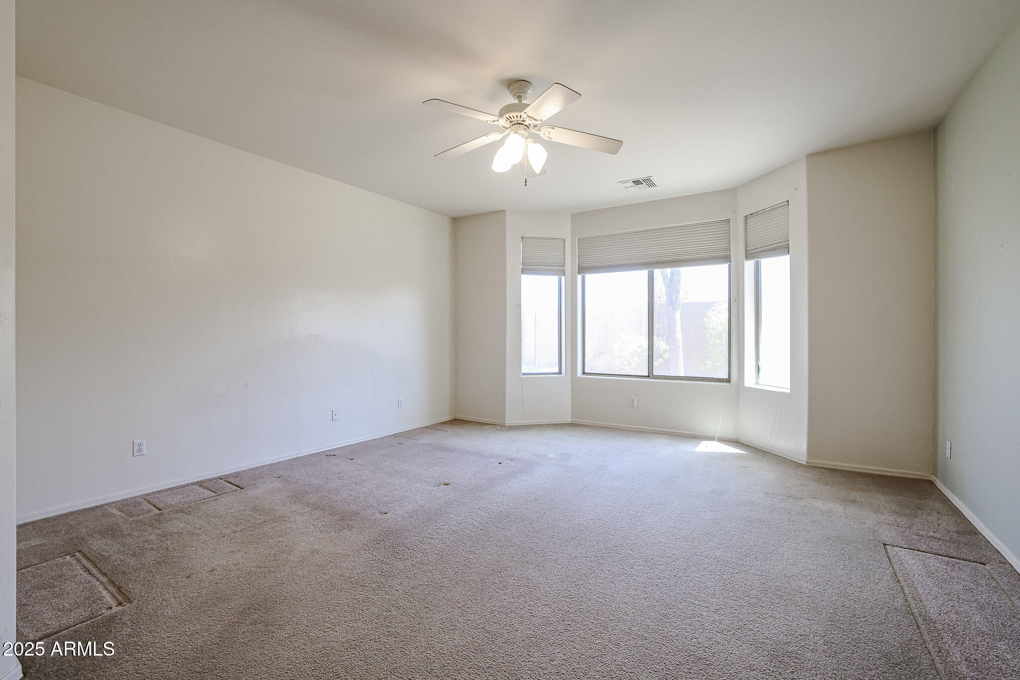 16617 North 40th Drive Phoenix, AZ 85053 - Photo 13 of 15 a view of an empty room with a window