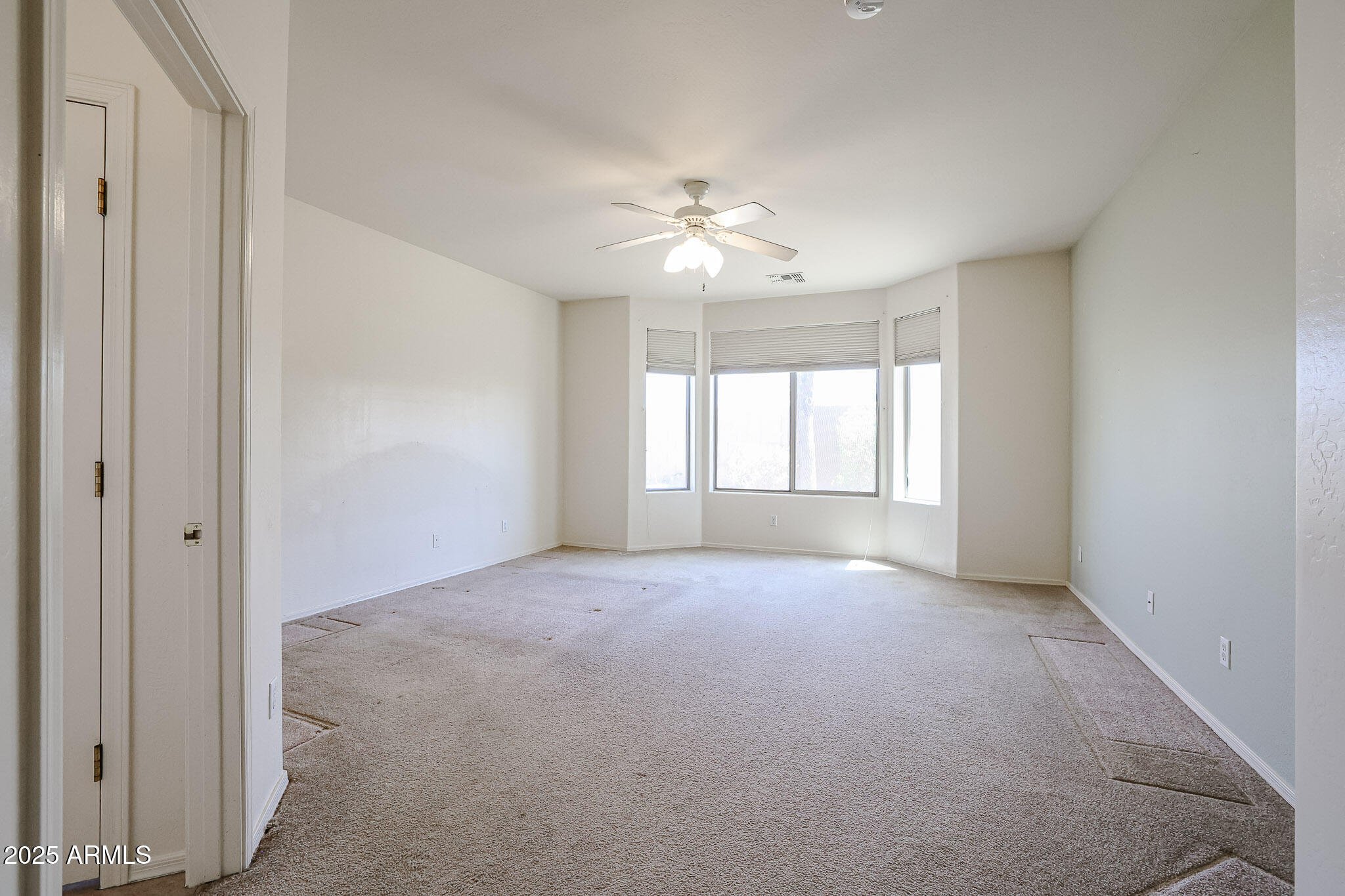 16617 North 40th Drive Phoenix, AZ 85053 - Photo 4 of 15 a view of an empty room with a window