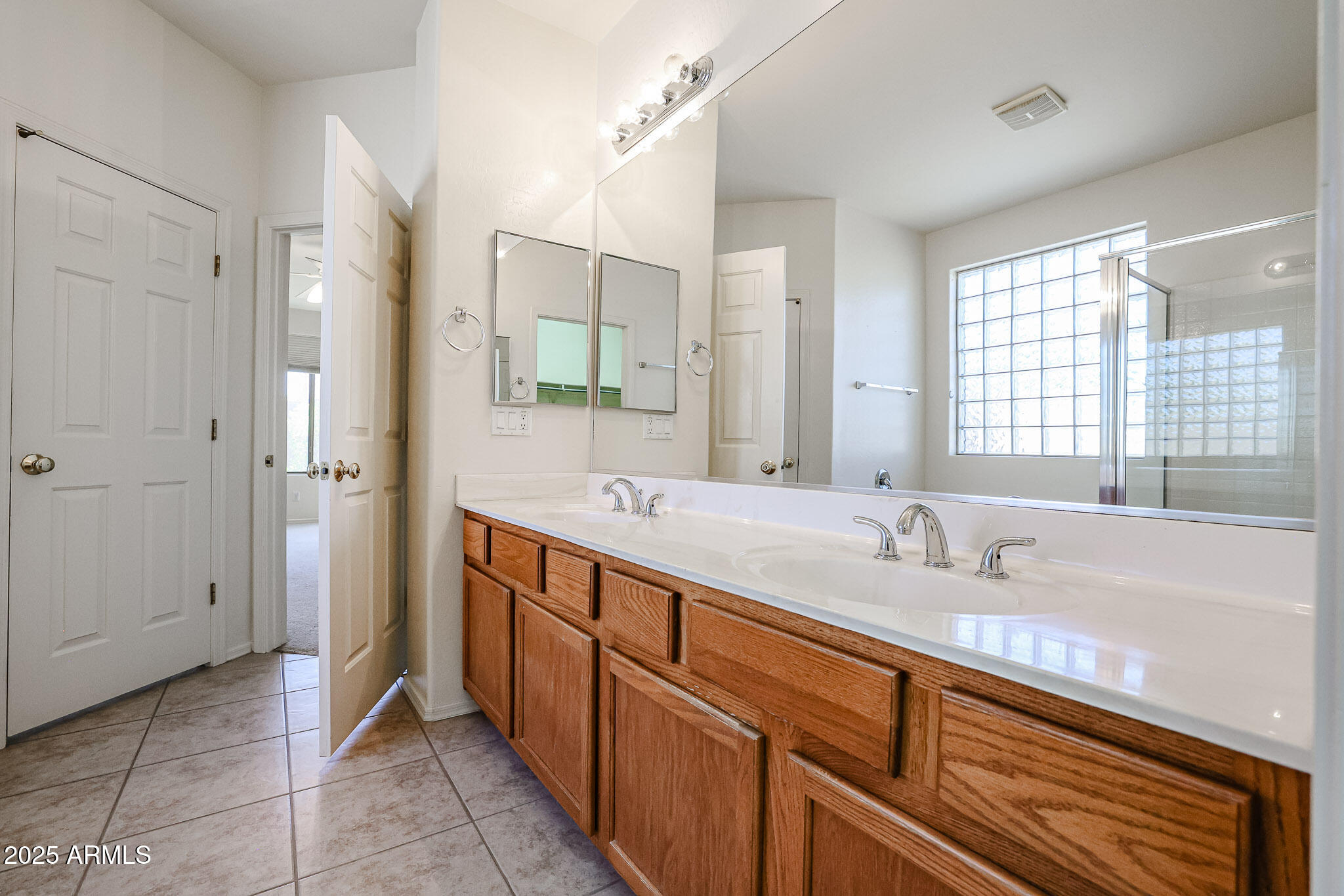 16617 North 40th Drive Phoenix, AZ 85053 - Photo 6 of 15 a bathroom with a granite countertop sink mirror and double