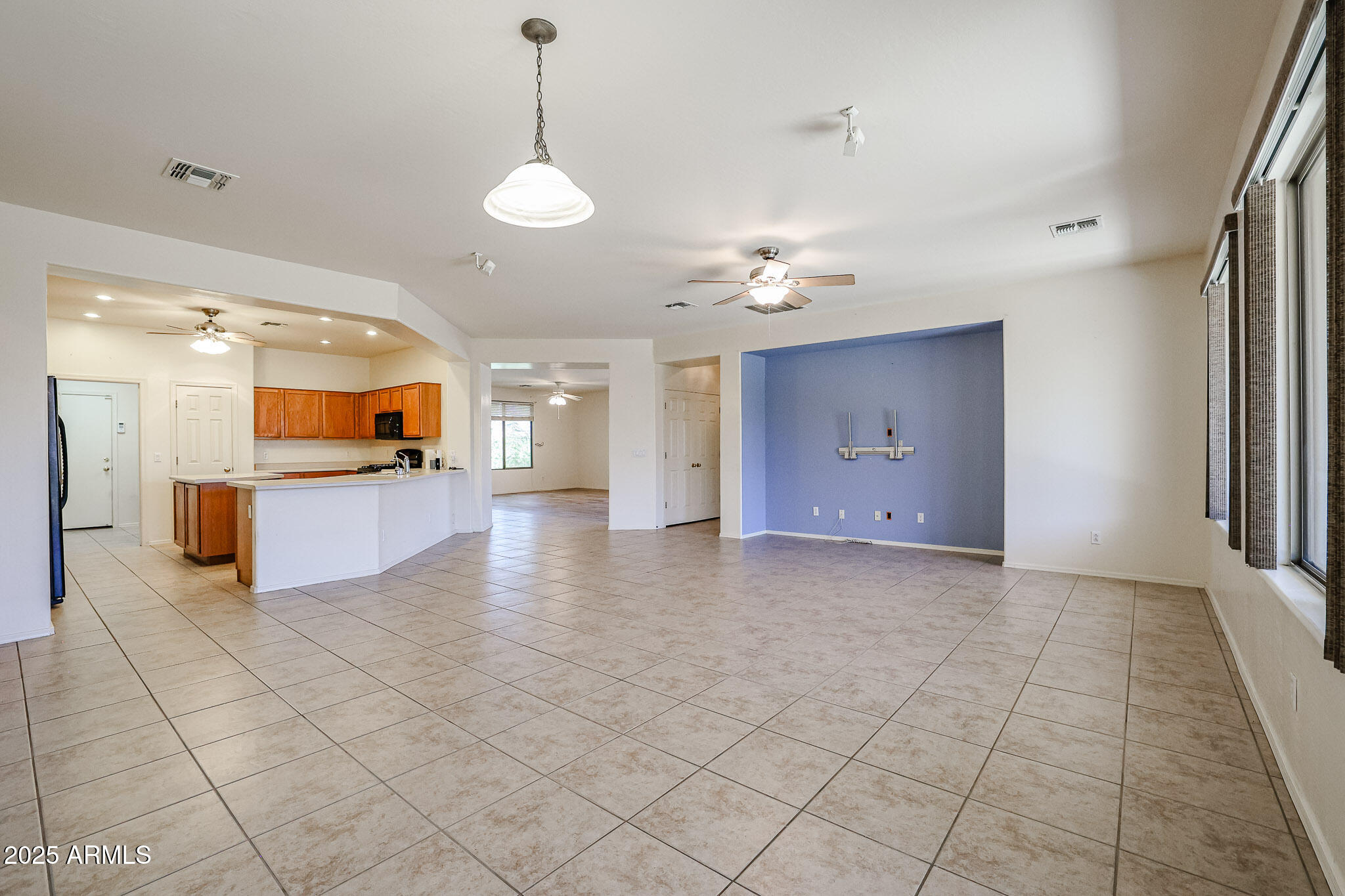 16617 North 40th Drive Phoenix, AZ 85053 - Photo 10 of 15 a view of a kitchen with a sink and a chandelier