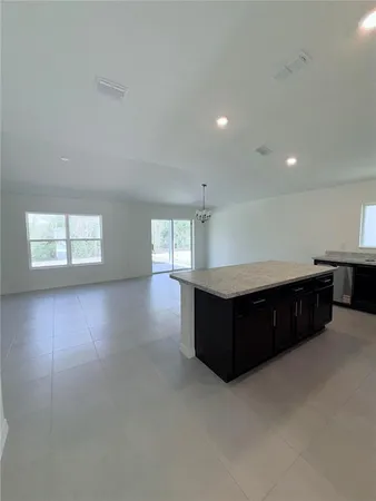 a room with a window and cabinet