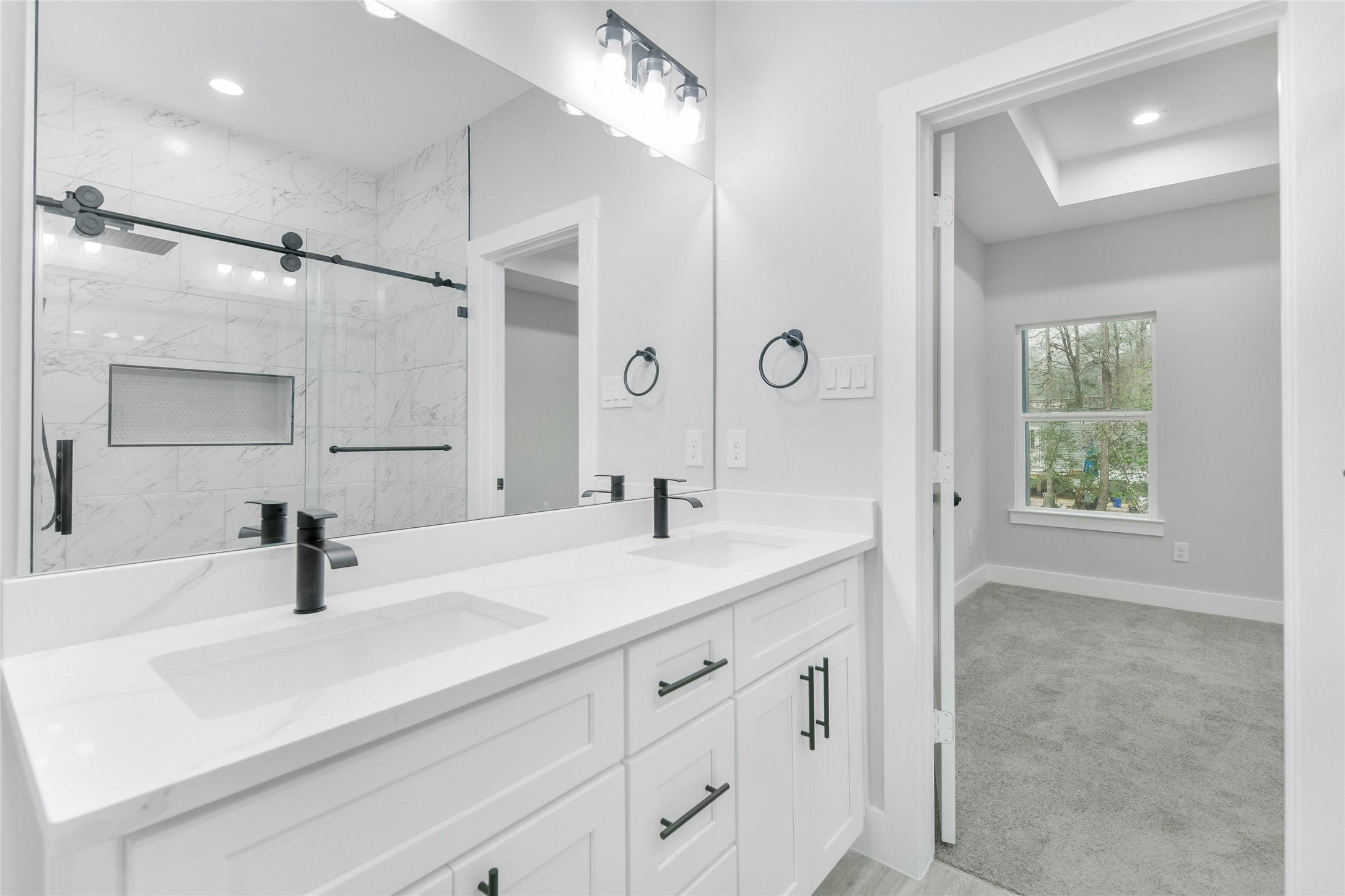 15117 Austin Road Willis, TX 77378 - Photo 20 of 35 a bathroom with a sink and a mirror