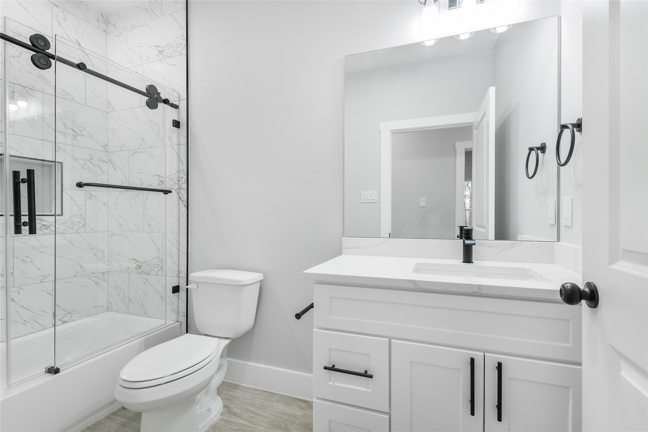 15117 Austin Road Willis, TX 77378 - Photo 25 of 35 a bathroom with a sink toilet and shower