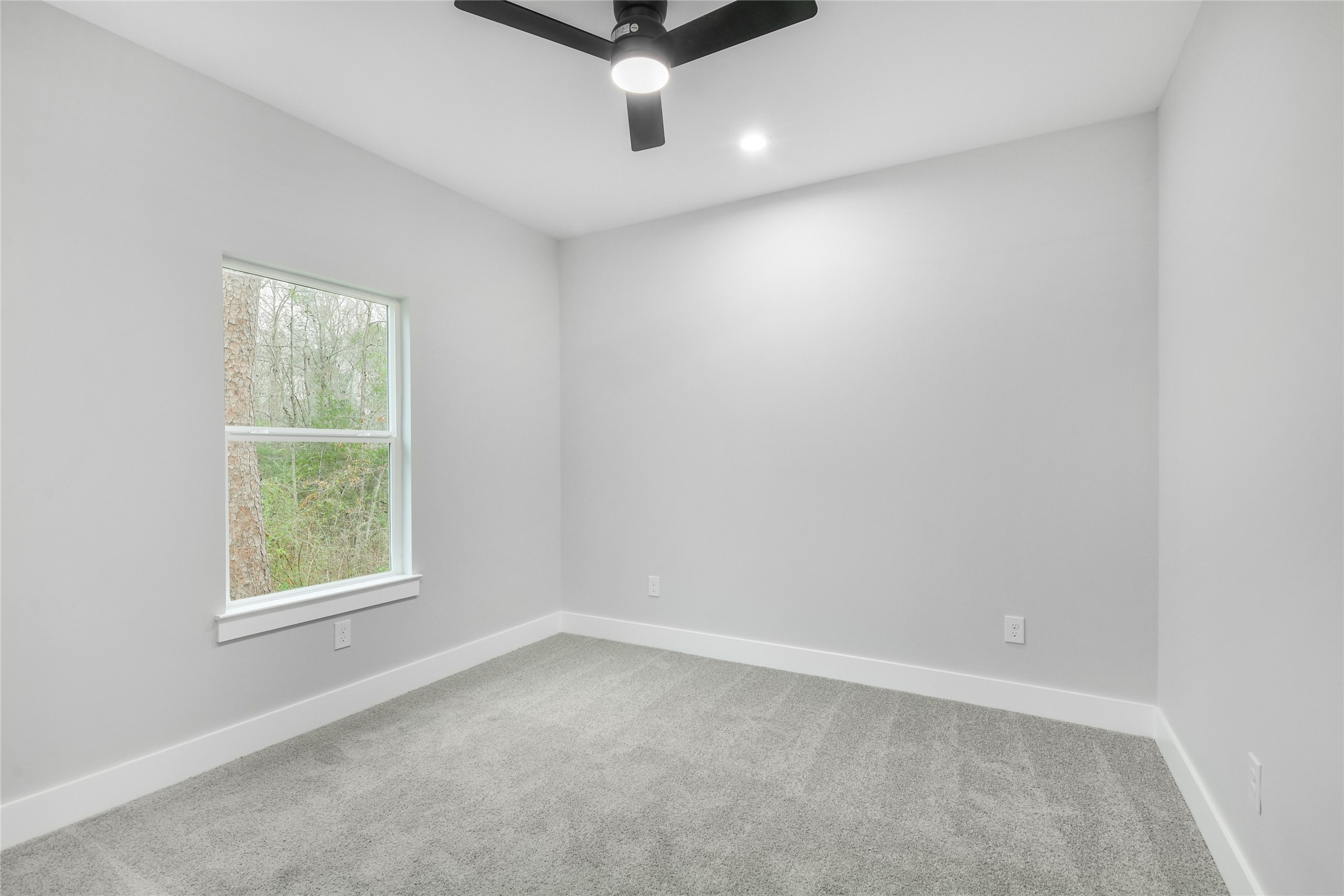15117 Austin Road Willis, TX 77378 - Photo 27 of 35 an empty room with a window