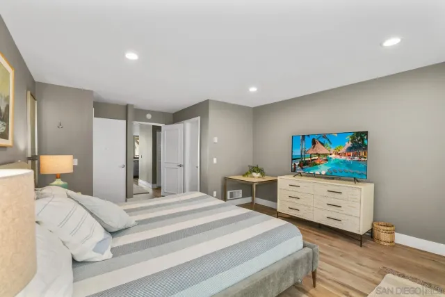 a bedroom with a bed and a dresser