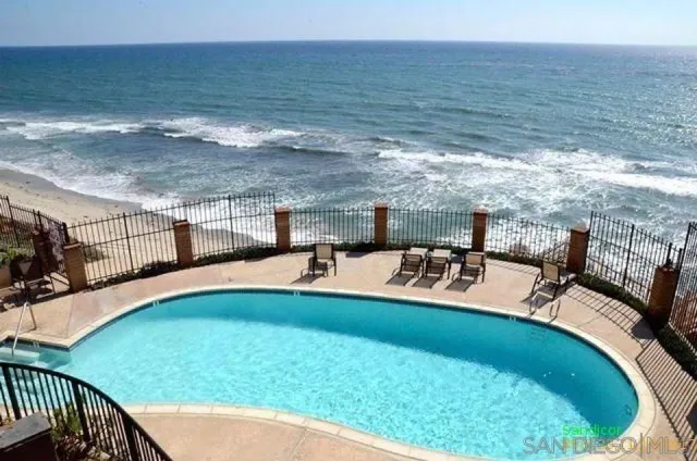 a view of a swimming pool with a yard