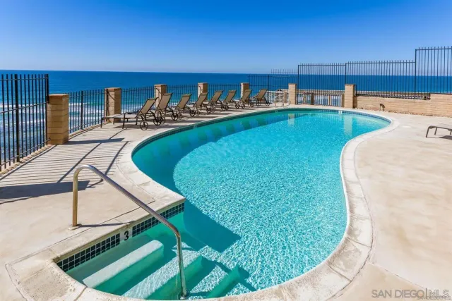 a view of a swimming pool with a chairs