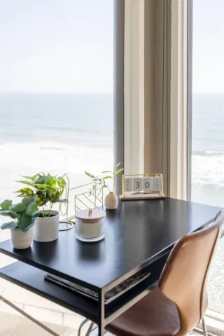 a view of a living room with furniture and potted plant