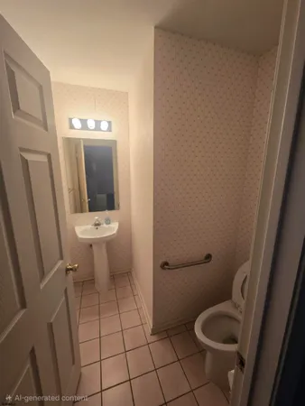 a bathroom with a toilet and a sink