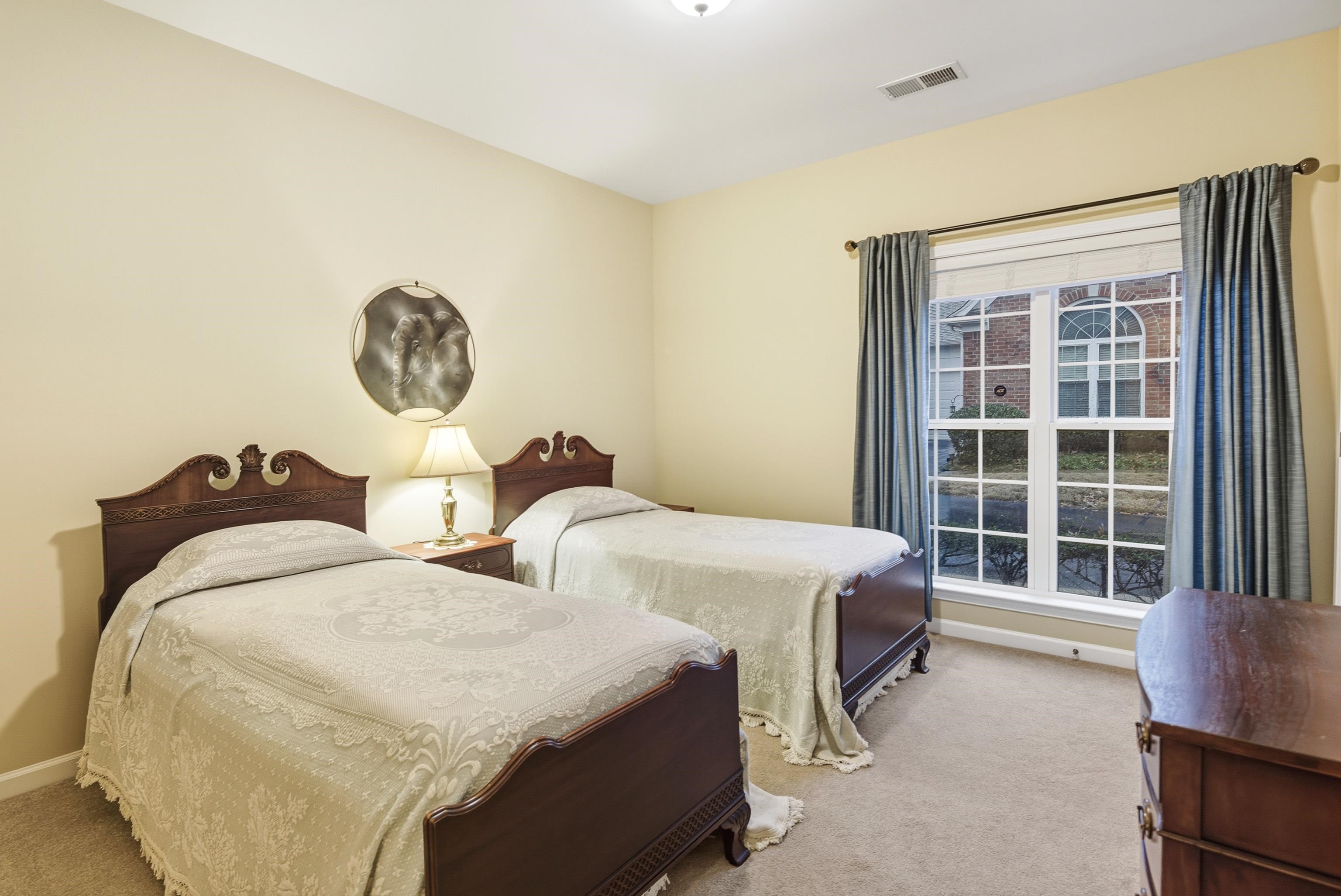 43 Peyton Ridge Drive, Unit 40 Collierville, TN 38017 - Photo 11 of 31 a bedroom with two beds and a large window