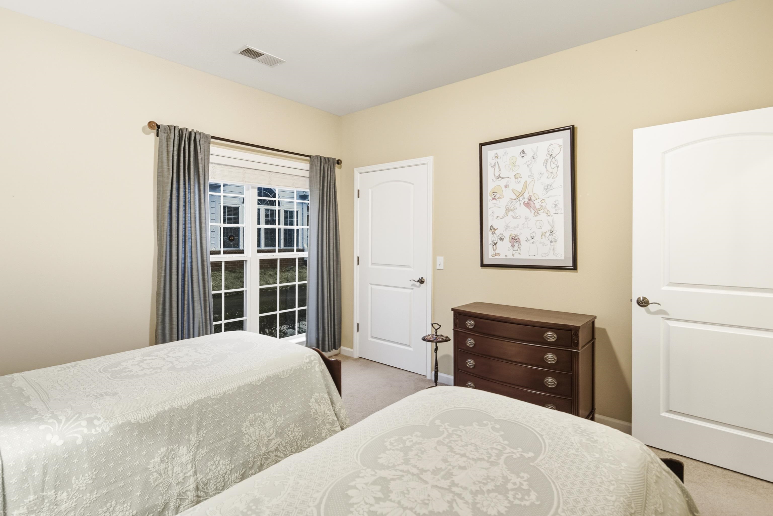 43 Peyton Ridge Drive, Unit 40 Collierville, TN 38017 - Photo 12 of 31 a bedroom with two beds and a window