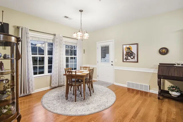 a view of a livingroom with furniture window and wooden floor