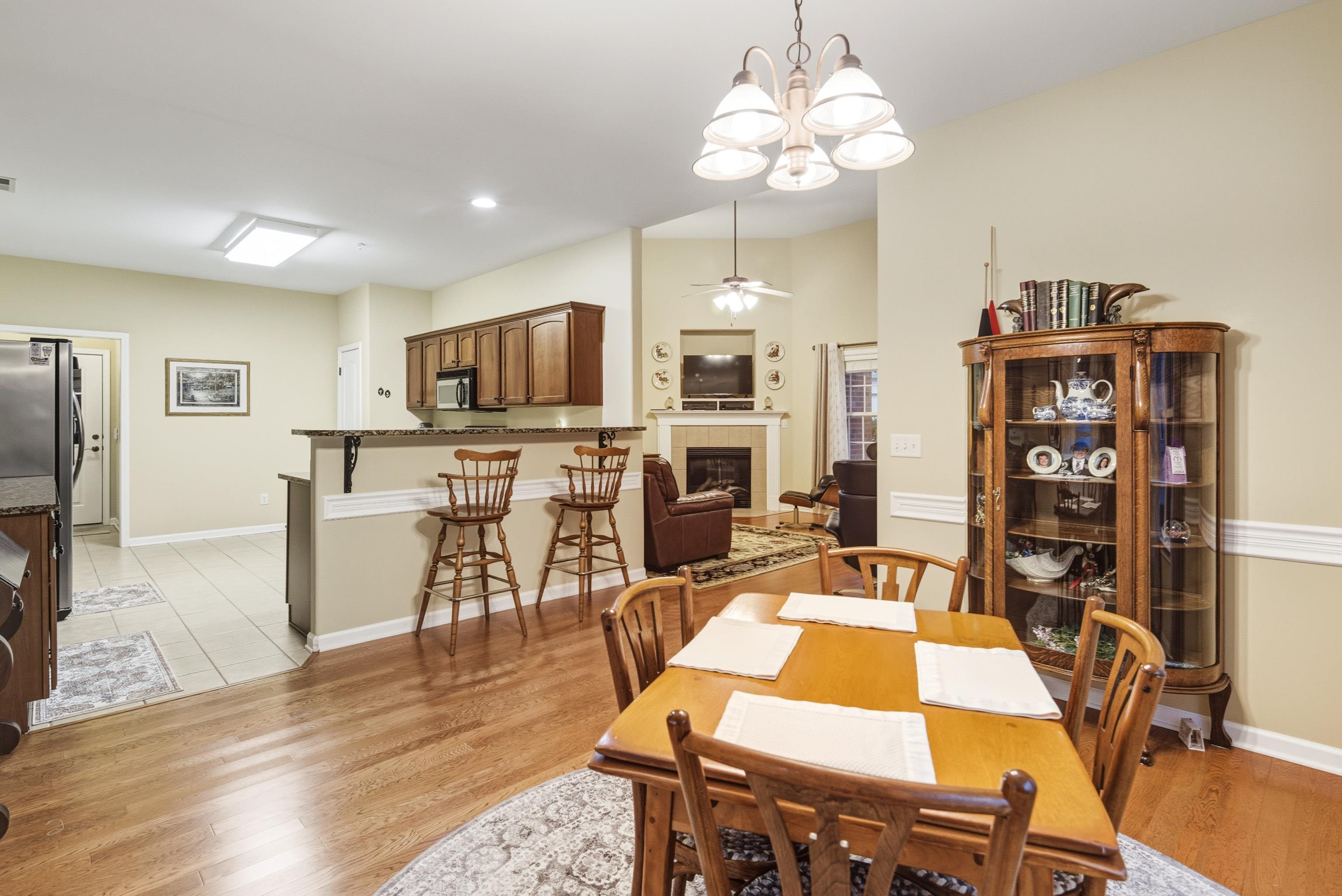 43 Peyton Ridge Drive, Unit 40 Collierville, TN 38017 - Photo 14 of 31 a view of a dining room with furniture and wooden floor