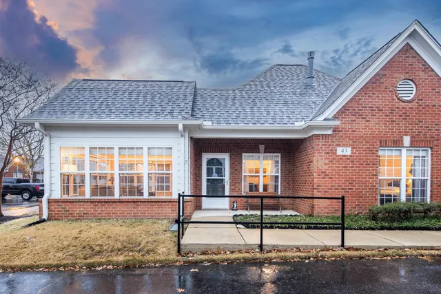 a bedroom with two beds and a window