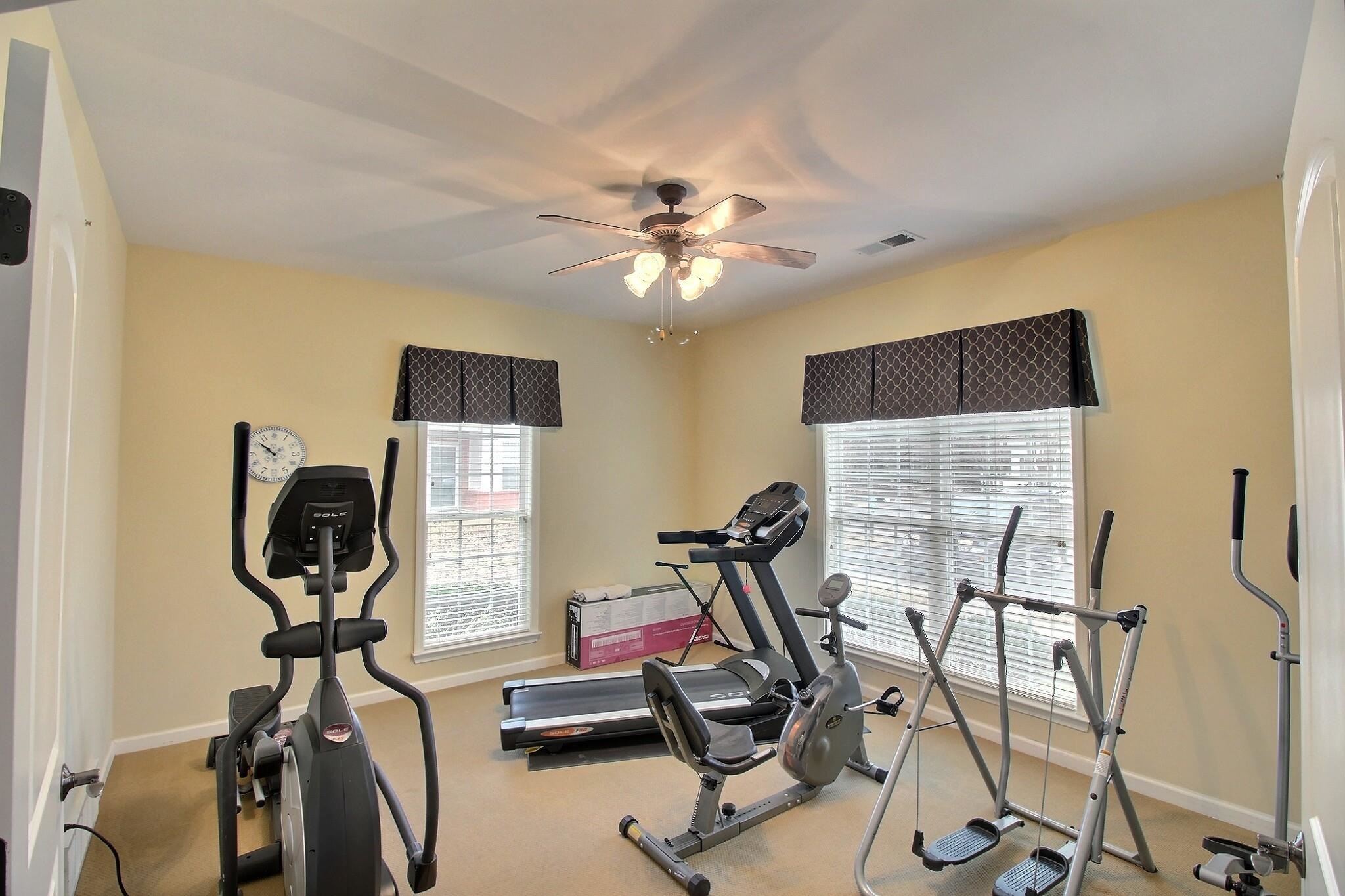 43 Peyton Ridge Drive, Unit 40 Collierville, TN 38017 - Photo 27 of 31 a view of a workspace with furniture and a gym machine
