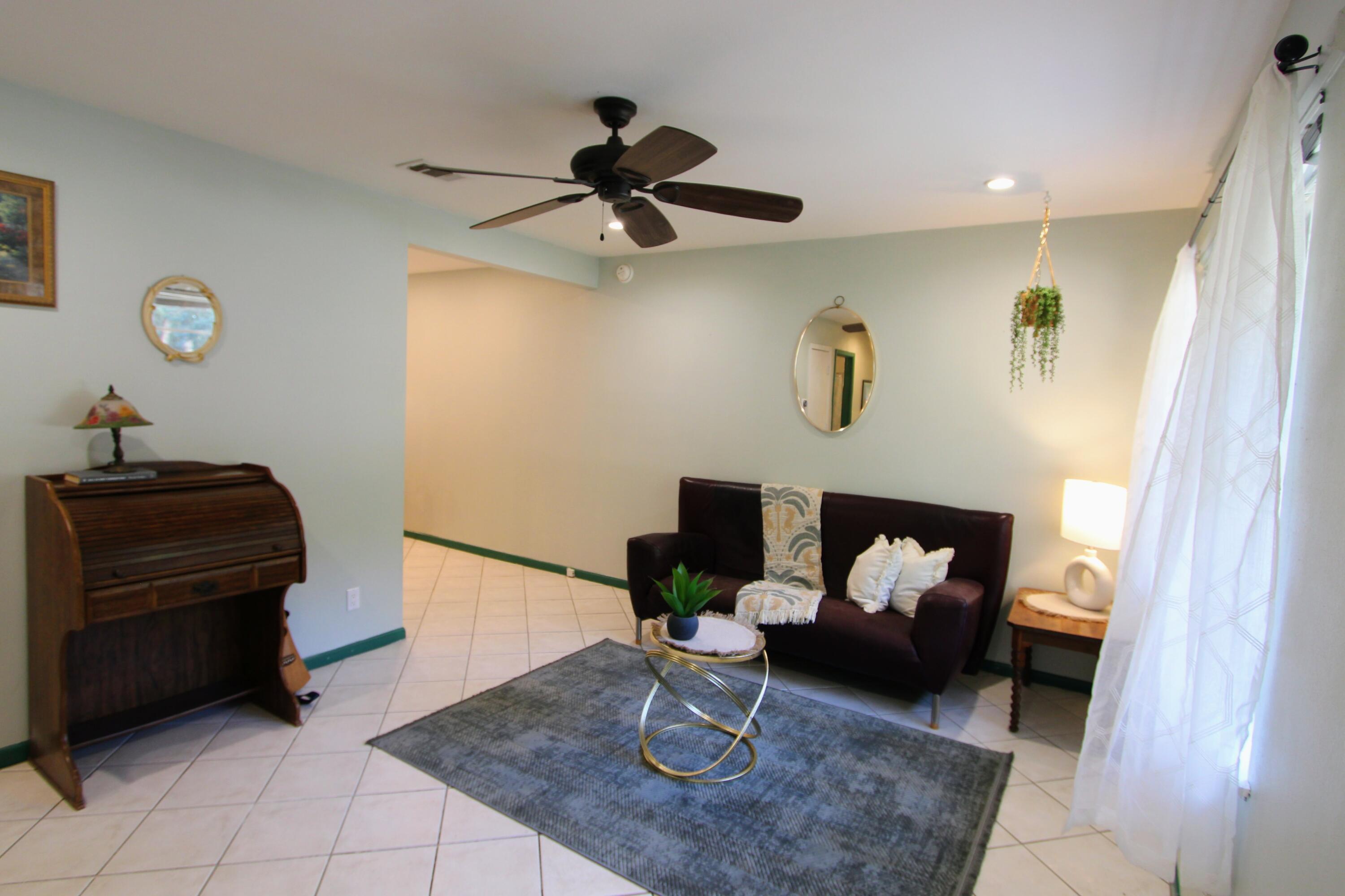 a living room with furniture and a window