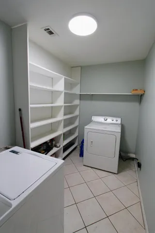 a storage room with a washer and dryer