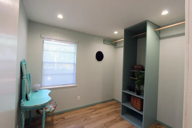 a view of an entryway with wooden floor