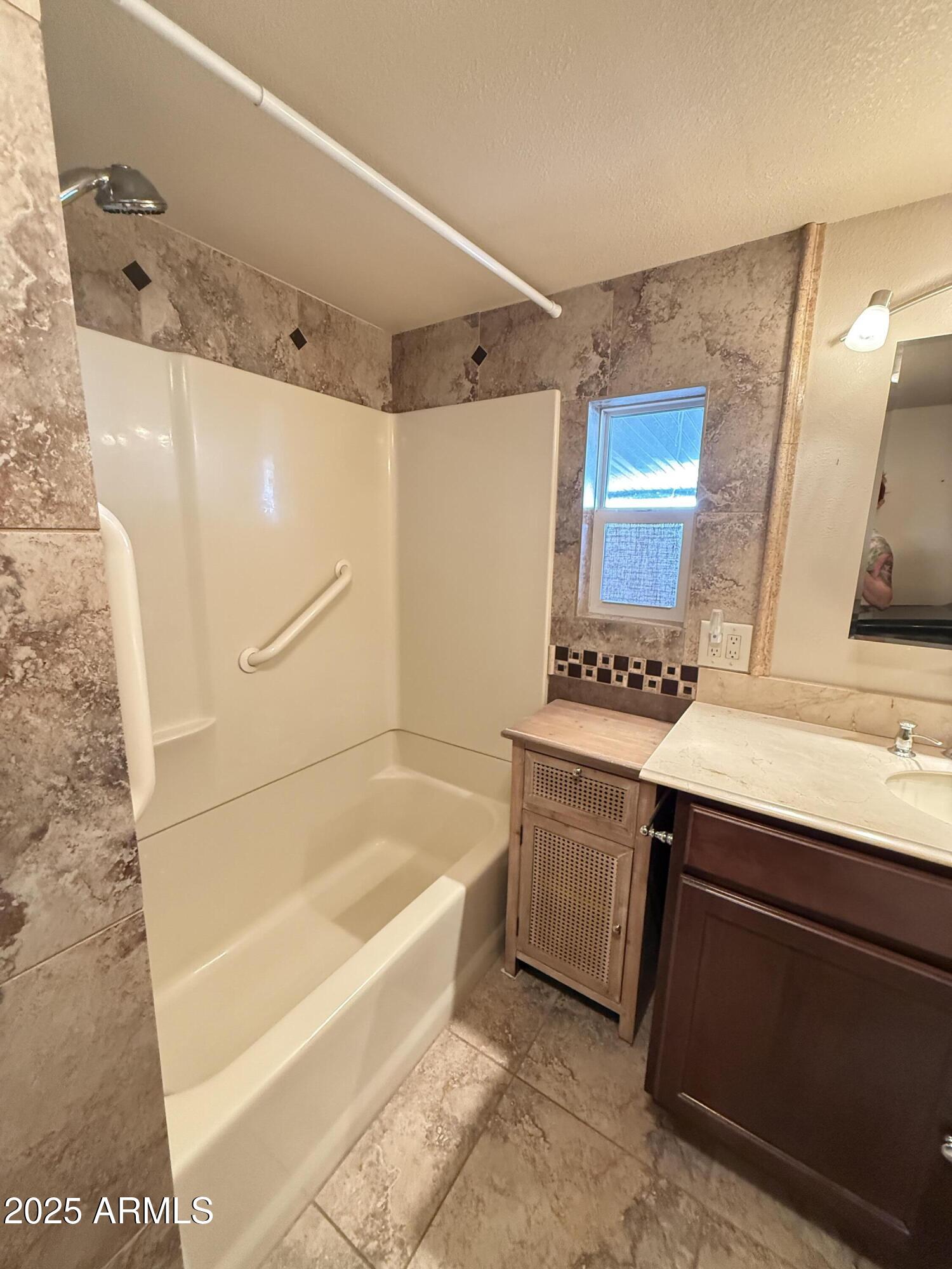 535 South Alma School Road, Unit 91 Mesa, AZ 85210 - Photo 15 of 26 a bathroom with a bathtub and a sink