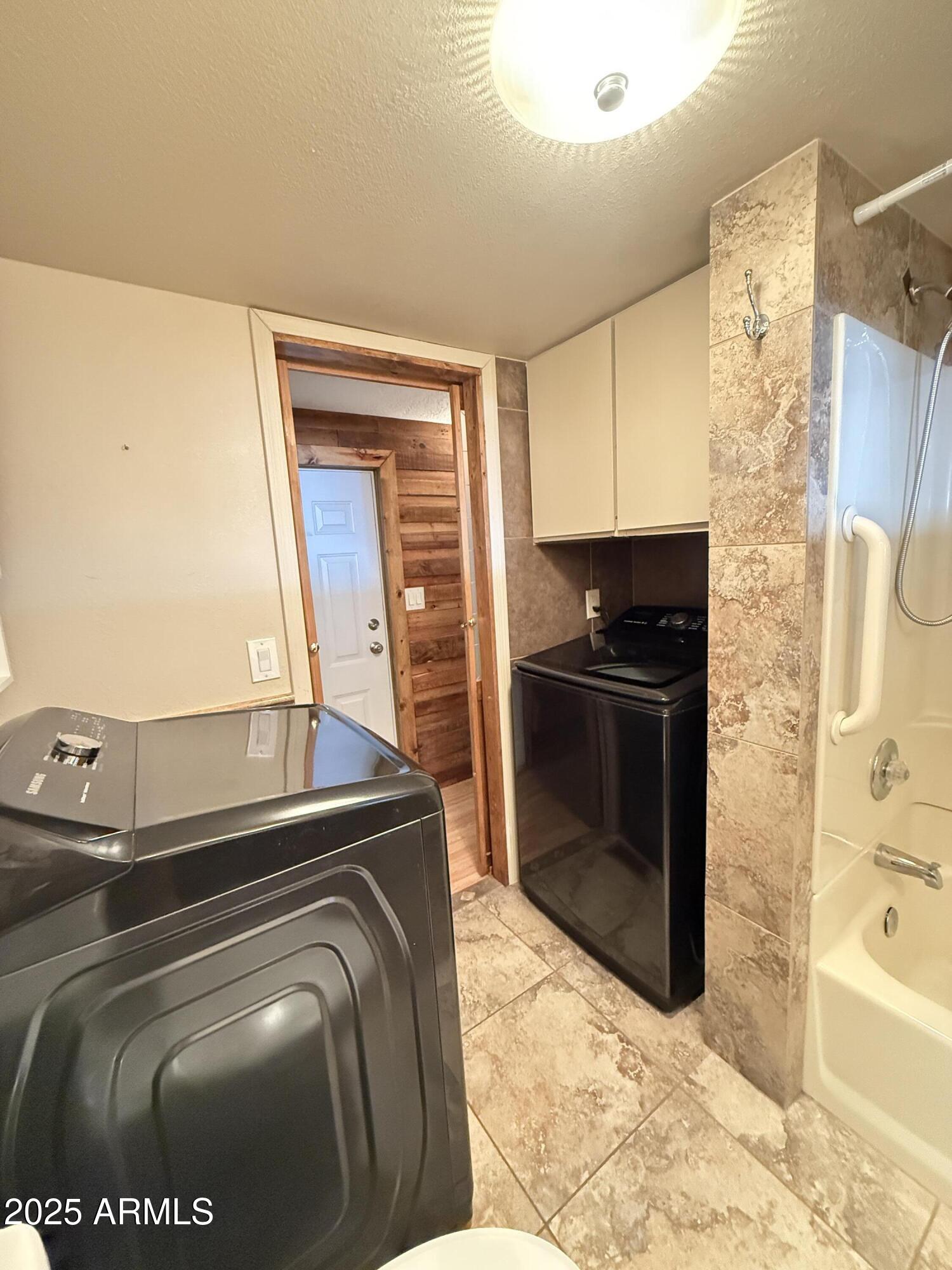 535 South Alma School Road, Unit 91 Mesa, AZ 85210 - Photo 17 of 26 a utility room with washer and dryer