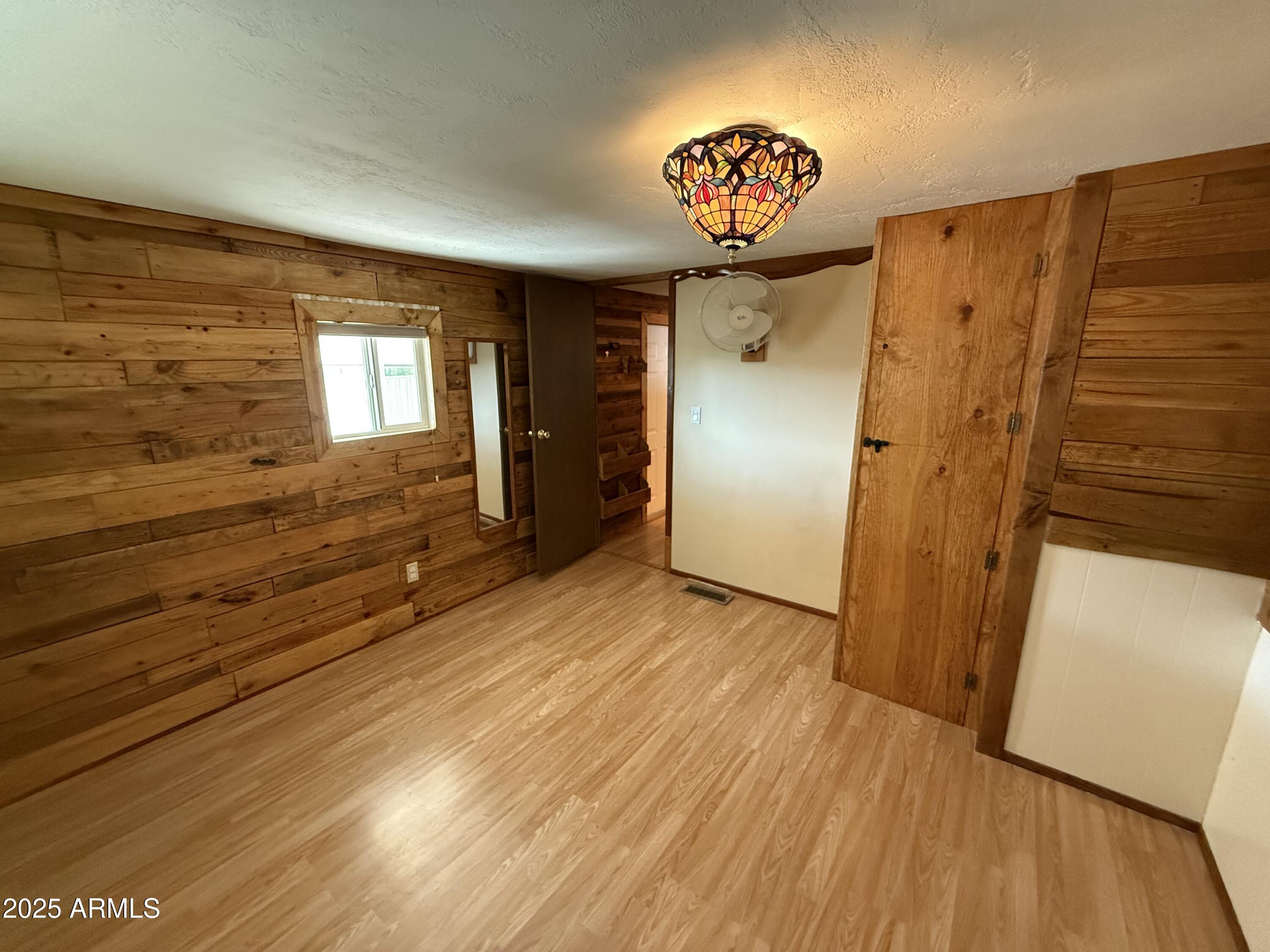 535 South Alma School Road, Unit 91 Mesa, AZ 85210 - Photo 25 of 26 a view of a hallway with wooden floor