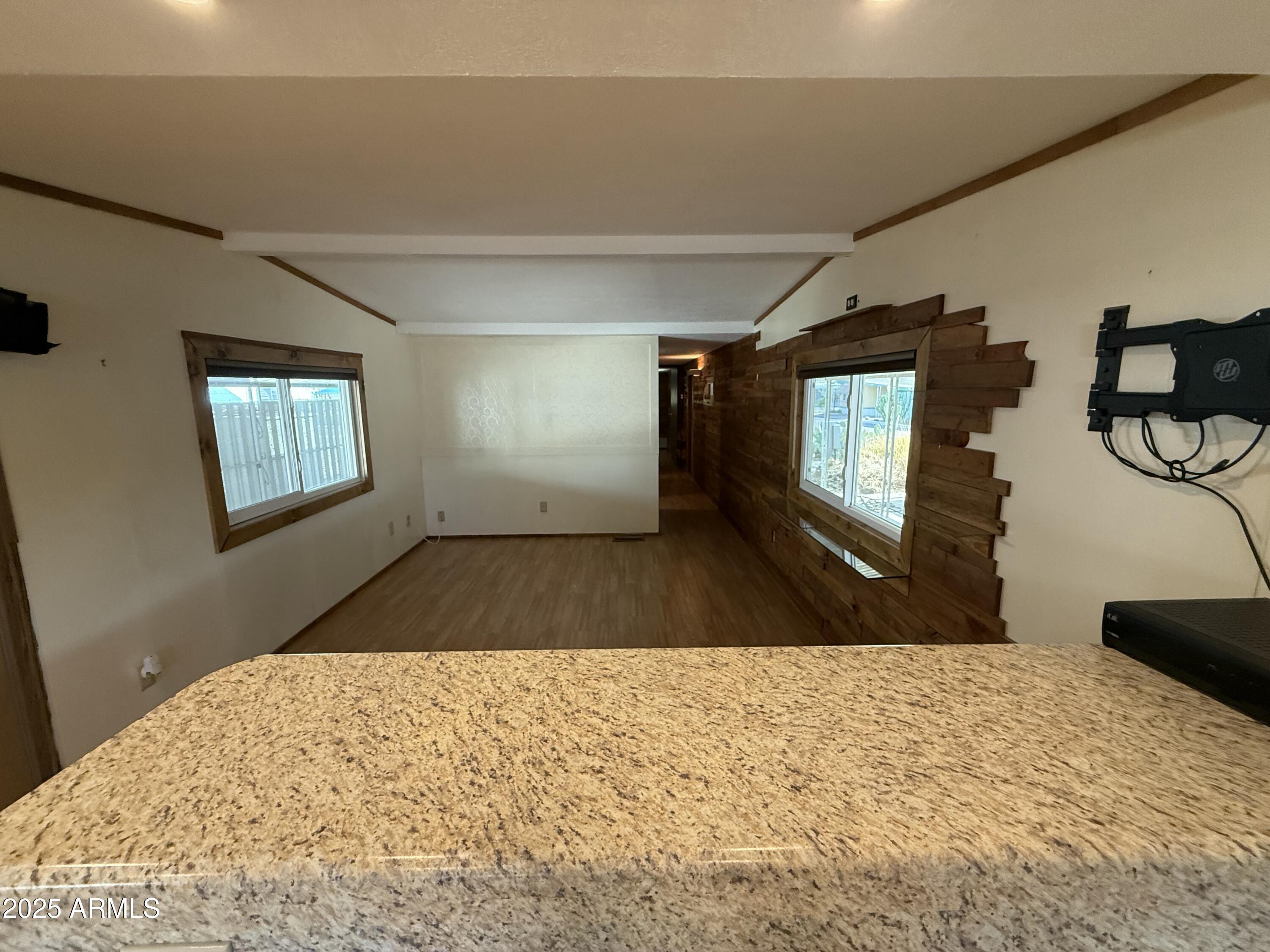 535 South Alma School Road, Unit 91 Mesa, AZ 85210 - Photo 6 of 26 a bedroom with a bed and a flat screen tv