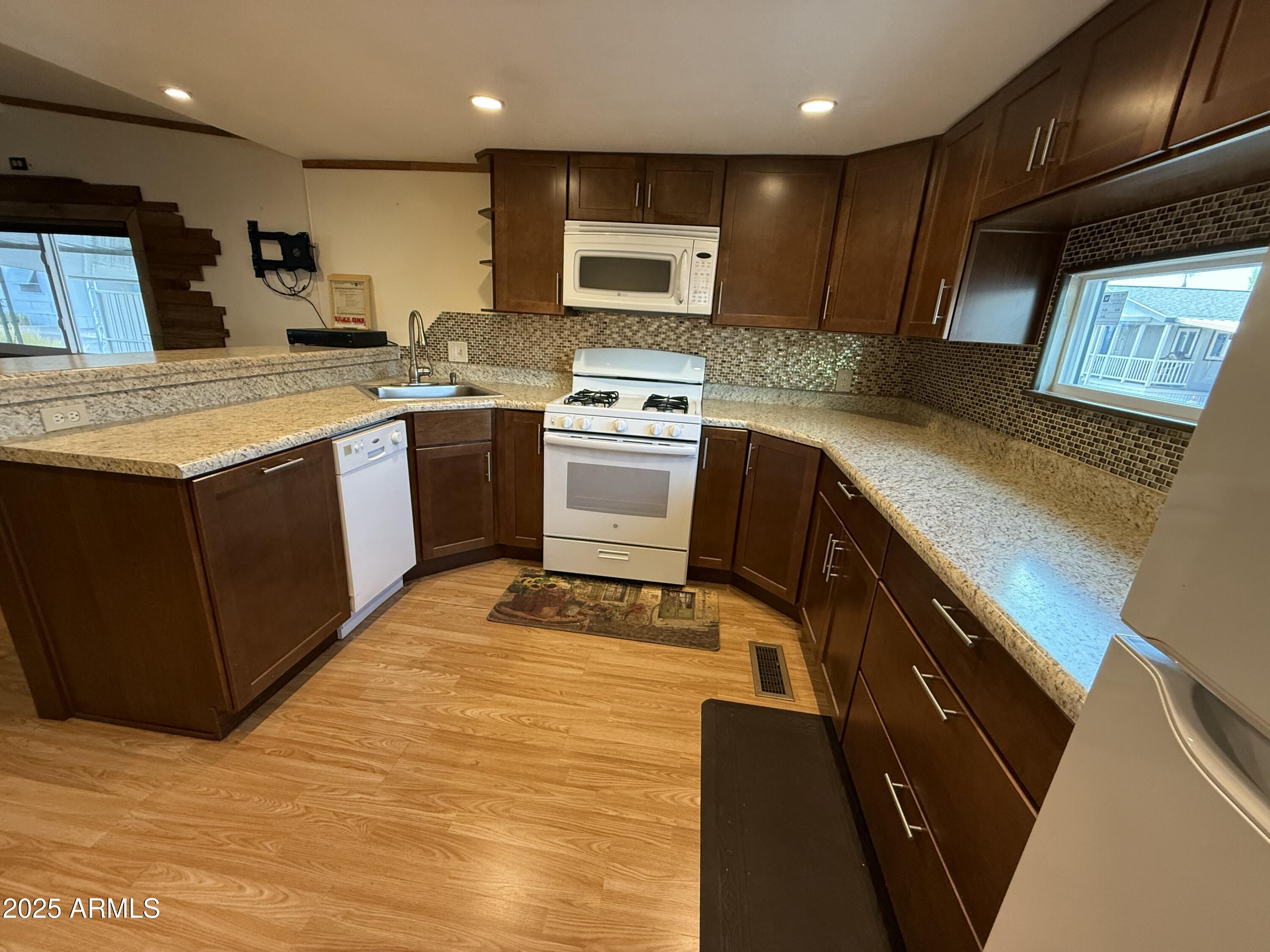 535 South Alma School Road, Unit 91 Mesa, AZ 85210 - Photo 9 of 26 a kitchen with a sink and cabinets