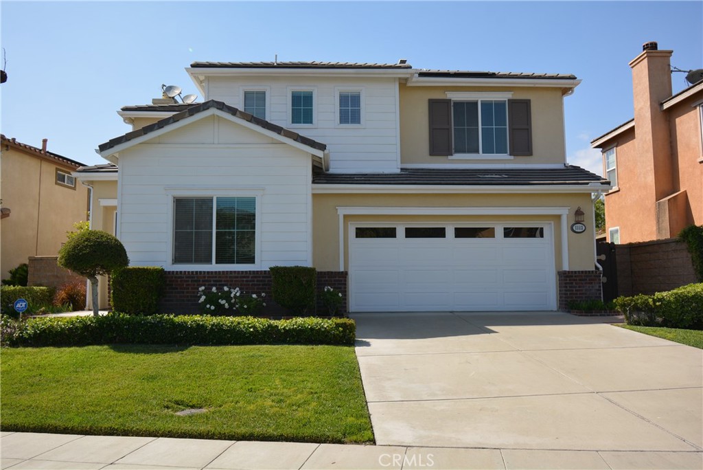 1803 Glen Rosa Street Upland, CA 91784 - Photo 1 of 68 a front view of a house with a yard and garage