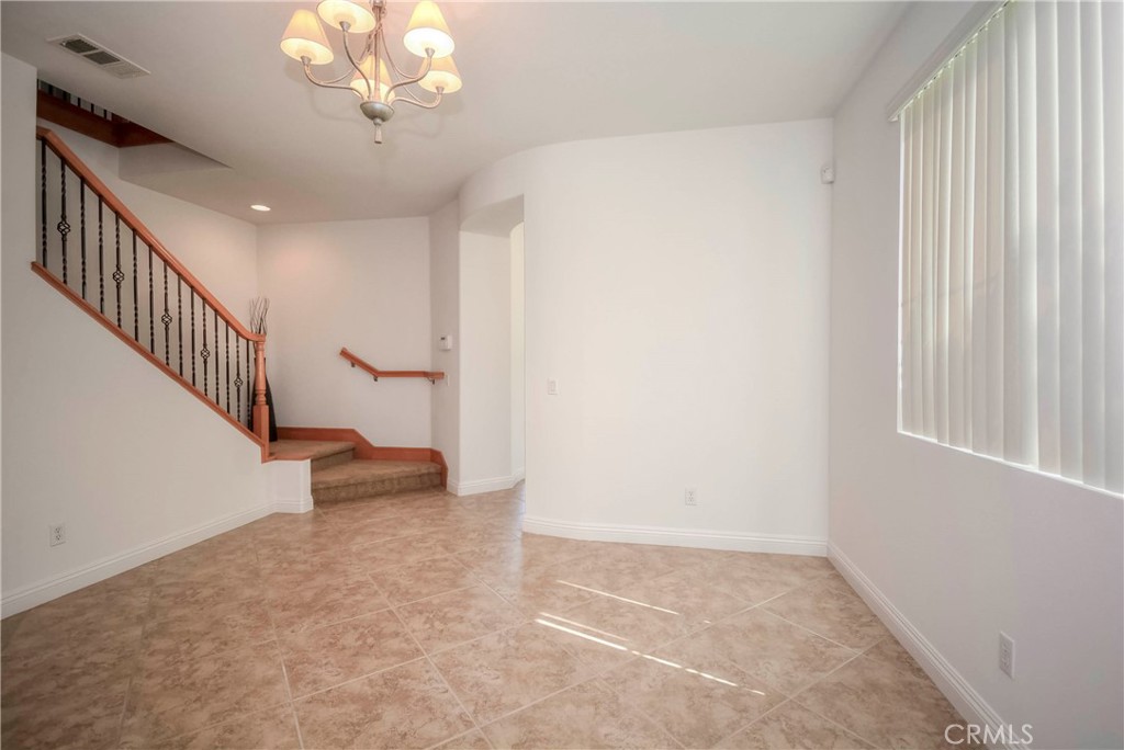 1803 Glen Rosa Street Upland, CA 91784 - Photo 13 of 68 a view of an empty room with a window