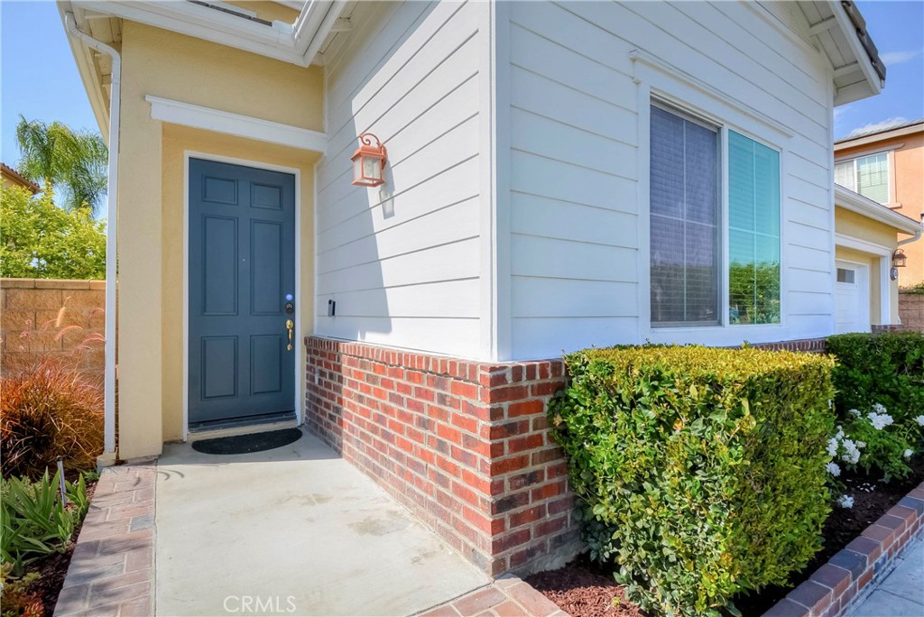 1803 Glen Rosa Street Upland, CA 91784 - Photo 22 of 68 a front view of a house with a garden