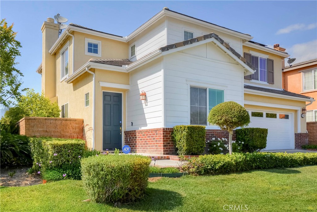 1803 Glen Rosa Street Upland, CA 91784 - Photo 26 of 68 a front view of a house with a yard and plants