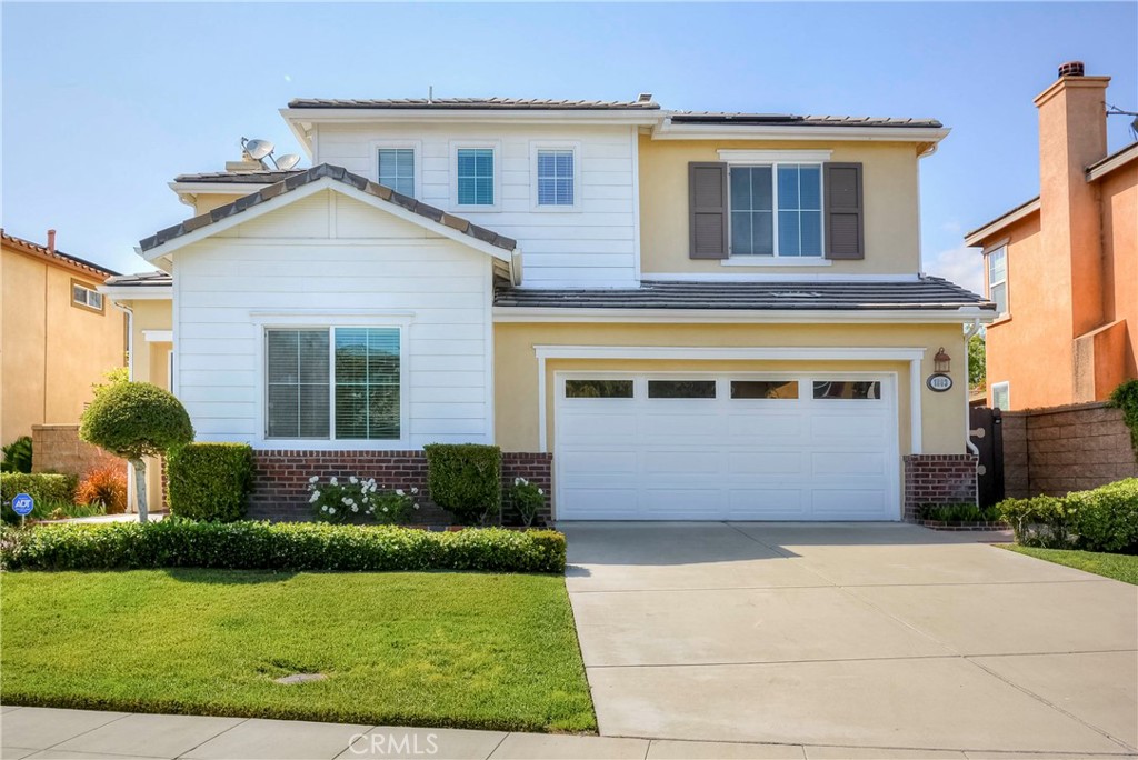 1803 Glen Rosa Street Upland, CA 91784 - Photo 27 of 68 a front view of a house with a yard and garage