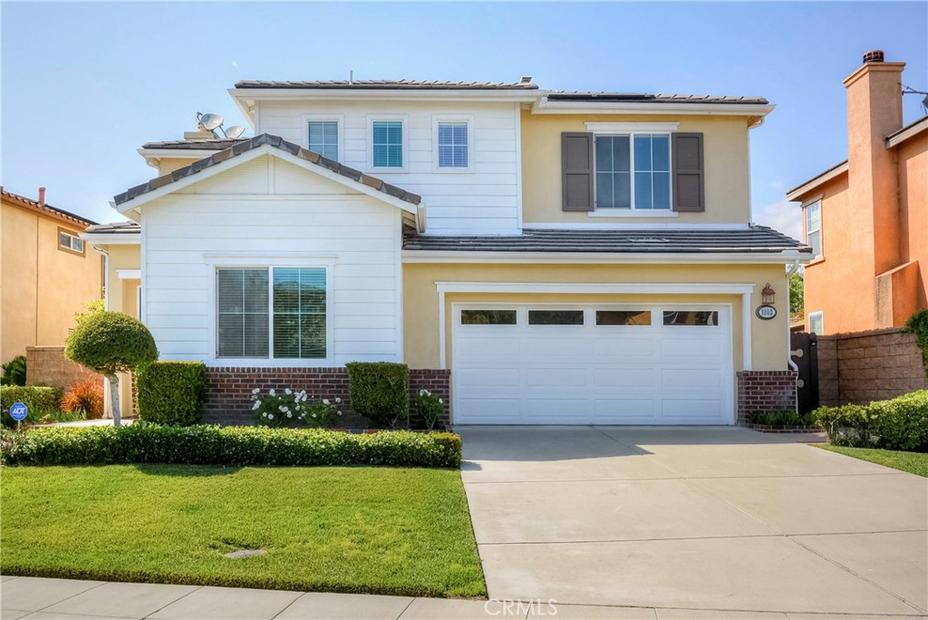 1803 Glen Rosa Street Upland, CA 91784 - Photo 29 of 68 a front view of a house with a yard and garage