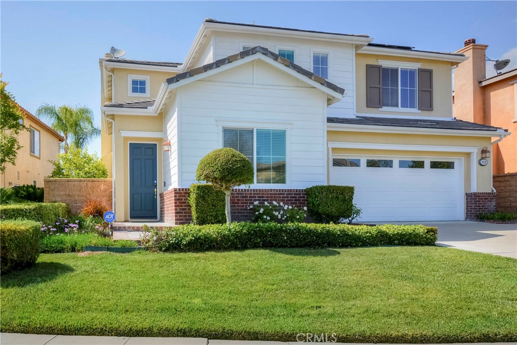1803 Glen Rosa Street Upland, CA 91784 - Photo 31 of 68 a front view of a house with a yard and garage