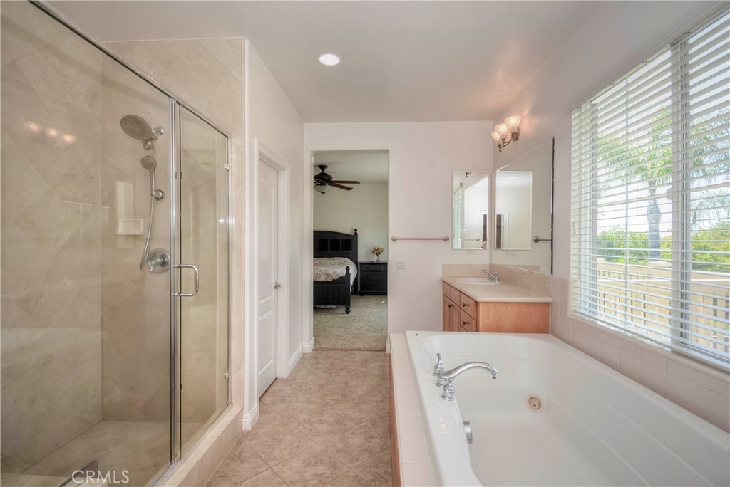 1803 Glen Rosa Street Upland, CA 91784 - Photo 39 of 68 a large en suite bathroom with a tub shower and window