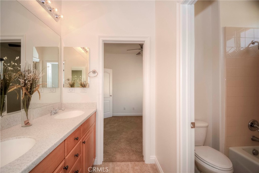 1803 Glen Rosa Street Upland, CA 91784 - Photo 49 of 68 a bathroom with a sink and a mirror